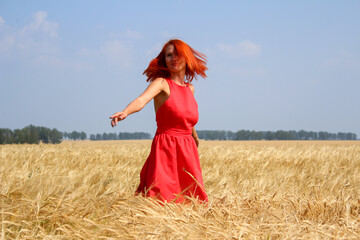 red-haired beautiful girl in the field