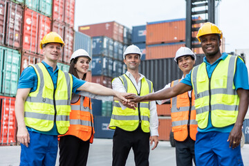 Group of young male and female worker working in container terminal. 