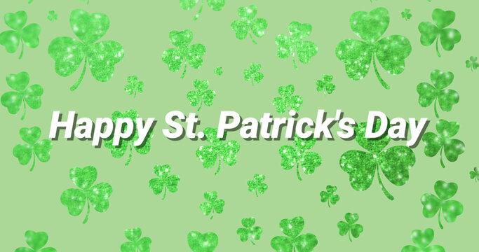 Image of the words Happy St. Patrick's Day written on green clovers background