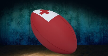 Composition of rugby ball decorated with the flag of tonga on black background