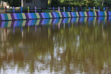 close-up of the dam's aqueduct twisting gears. water coming out of the dam. water from irrigation canals.