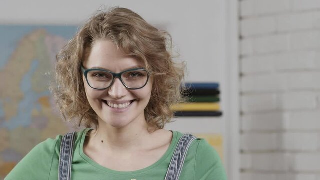 Close up of teacher woman in the classroom. Learning concept. Funny tutor in school.