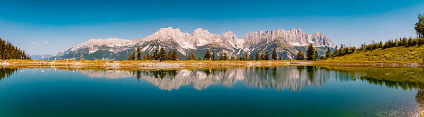 High resolution panorama with reflections in a lake at the famous Astberg summit, Going, Wilder Kaiser, Tyrol, Austria