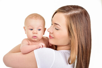 Mother and baby playing and smiling. Happy family.