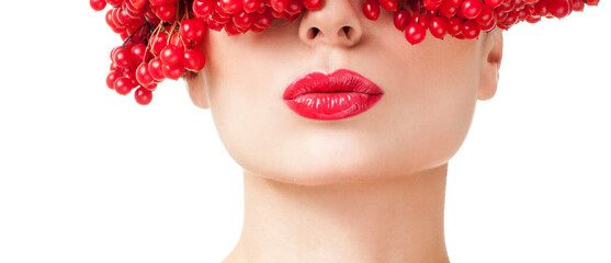 beautiful woman in hat of red berries. Red lipstick. Professional makeup