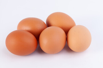 five eggs are placed on a white background with free space on right