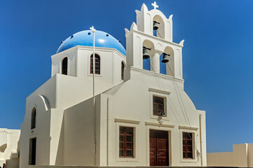 Fototapeta na wymiar Facade of the traditional church on Santorini Greece