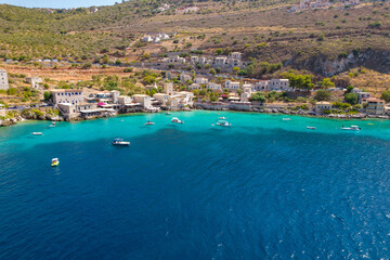 Fototapeta na wymiar Aerial panoramic photo of Limeni the picturesque villlage with the turquoise waters and the stone buildings under Areopoli, peloponnese , Greece.