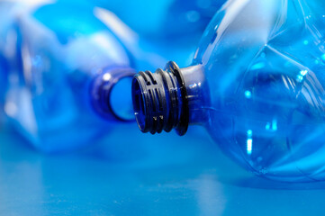 empty blue plastic bottles, recycling concept