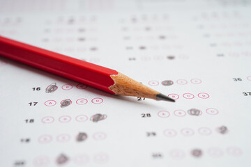 Answer sheets with pencil drawing fill to select choice, education concept.