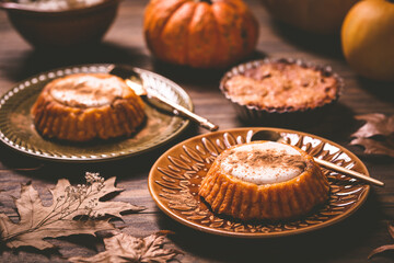 Pumpkin mini pie, tartlet made for Thanksgiving day on old wooden background