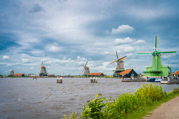 Fototapeta premium Traditional dutch windmill near the canal. Netherlands