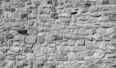 Gray antique stone wall as background.
