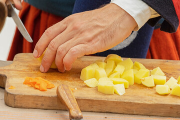 Cutting vegetables on wooden board