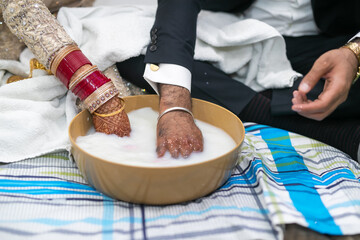 Indian Punjabi after wedding doli and pani varna ceremony hands close up - obrazy, fototapety, plakaty