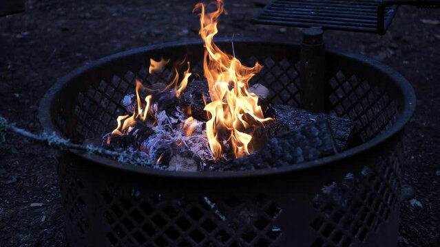 Campfire At Evening With Slow Burning Logs