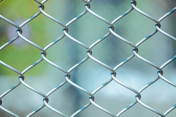Fototapeta premium Metal mesh on the fence as a background.
