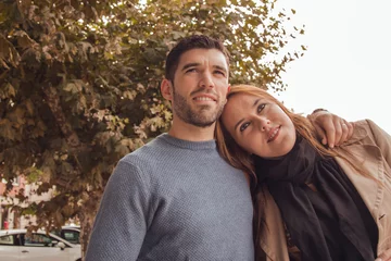 Fotobehang Chocoladebruin couple in love holding each other in autumn landscape  © tetxu