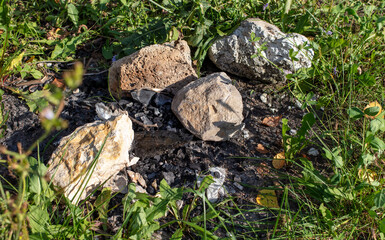 Large stones with coal after a fire