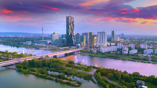 Vienna skyline aerial view drone video of Vienna austria city view from above, vienna skyscrapers river and bridge view from sky birds view at sunrise colored sky.