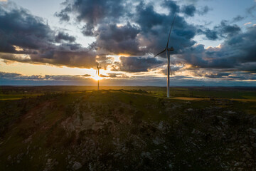 Looking down on wind turbines at sunrise.