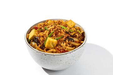 Asian fried noodles with tofu cheese and vegetables isolated on white background Vegetarian fried...