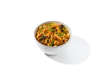 Asian fried noodles with shiitake mushrooms and vegetables isolated on white background Chinese fried noodles in vegetarian style in ceramic bowl. Stir-fry udon with vegetables and mushrooms