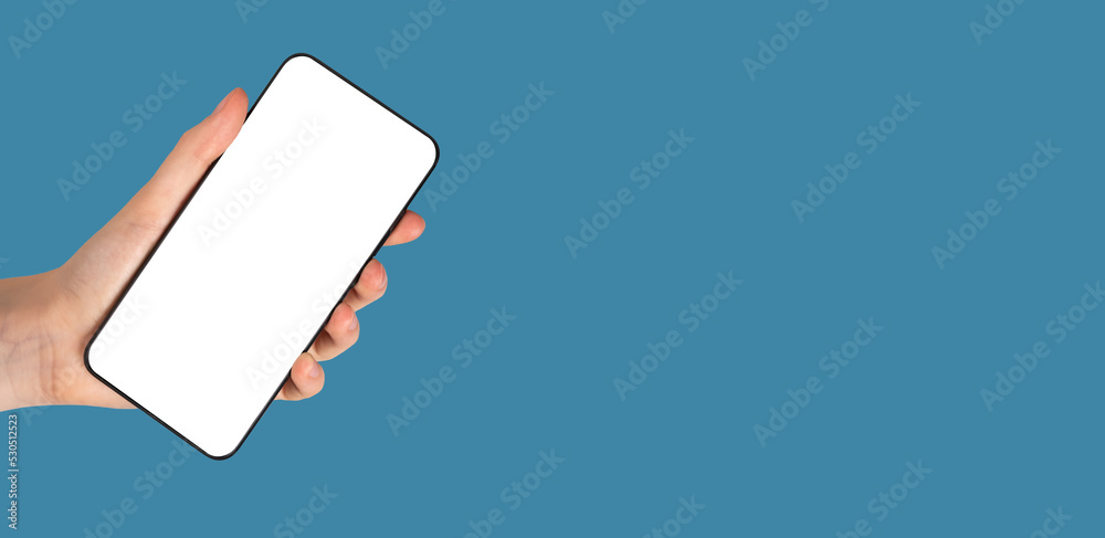 Poster banner with hand holding phone mockup in rotated position on blue background. smartphone template wi