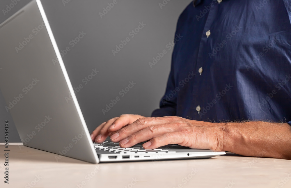 Poster Man hands typing on laptop keyboard. Male writing e-mail, preparing report, research, browsing Internet. Using computer in work and study