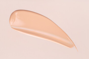 cosmetic smear foundation cream foundation on a beige background