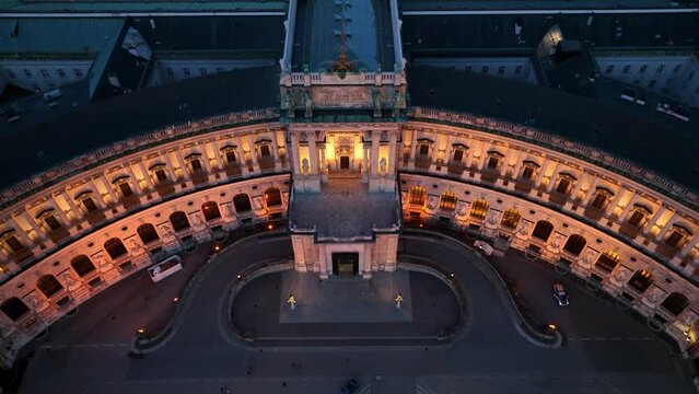 Vienna at night, the capital of Austria, aerial view of Vienna in the evening light, flying over famous Homburg palace in downtown Vienna 