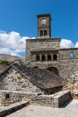 Clock Tower in Gjirokaster Citadel surrounded by ancient ruins, attraction in Albania, Europe - 530514999