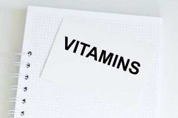 Vitamins text on card, medicine, concept background