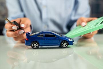 female sales representative used two hand-held small model cars.
