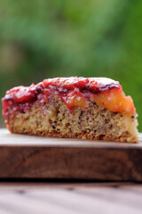 Plum pie. Rustic plum cake on a dark wooden background. High quality photo