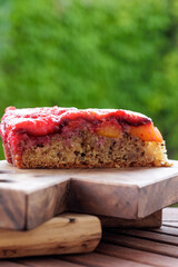 Plum pie. Rustic plum cake on a dark wooden background. High quality photo