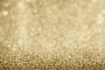 Abstract gold glitter sparkle blurred with bokeh background