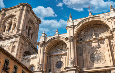 Fototapeta na wymiar Campanario y fachada principal de la basílica catedral siglo XVI de Granada, estilo renacimiento y barroco, España
