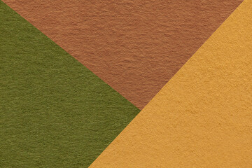 Texture of craft yellow, green and brown shade color paper background, macro. Vintage abstract...