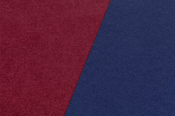 Fototapeta premium Texture of craft navy blue and dark red paper background, half two colors, macro. Vintage kraft wine cardboard.