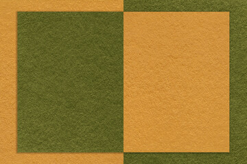 Fototapeta premium Texture of yellow and green paper background with geometric shape and pattern, macro. Craft olive cardboard