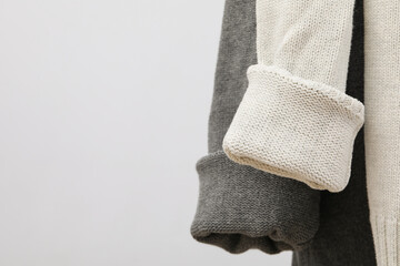 Hanging sweaters, concept of autumn season clothes