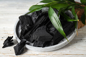 Natural wood or hardwood charcoal on wooden table