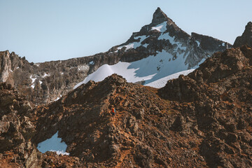 Hamperokken mountain climbing in Norway man hiking solo travel lifestyle adventure extreme active vacations outdoor alpine landscape