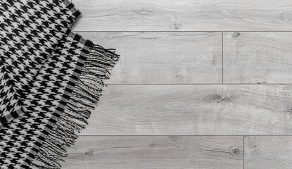 Warm blanket on the background of the laminate. There is a place for your text.