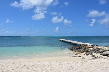 Scenic Seascape with A Dock and Deserted Beach