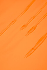 orange drips cannabis wax on orange background