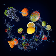 Wallpaper with fruits in water - juicy grapes, mango, lemon, kiwi, strawberry, lime, mango sweet dessert