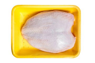 Raw chicken breast with skin in a yellow tray, poultry meat in container, isolated, top view