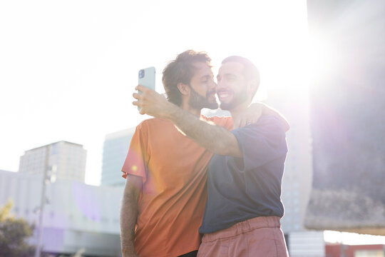 Gay couple taking selfie photo. LGBT community.